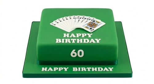 Square green birthday cake with edible playing cards and "Happy Birthday" message.
