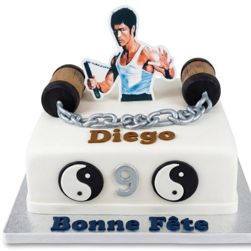 White square Bruce Lee birthday cake with nunchaku, Yin-Yang symbols, custom name and age.
