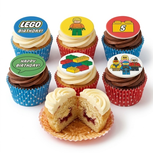 Assortment of LEGO® themed birthday cupcakes with building blocks, minifigures, and custom age toppers.