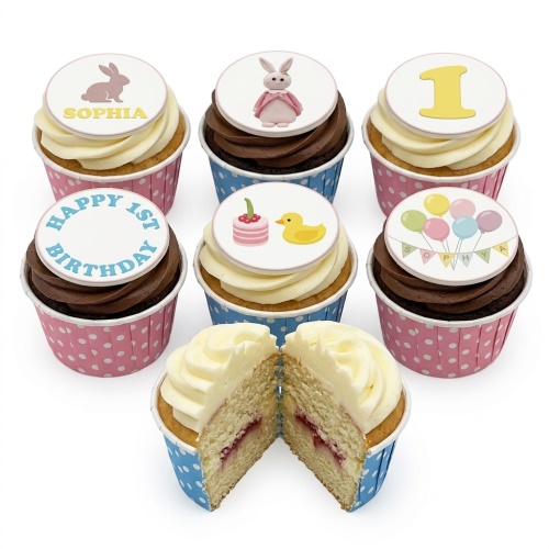 Assortment of 1st birthday cupcakes with baby animal, duck, bunny, and balloon toppers, featuring custom age and name examples.