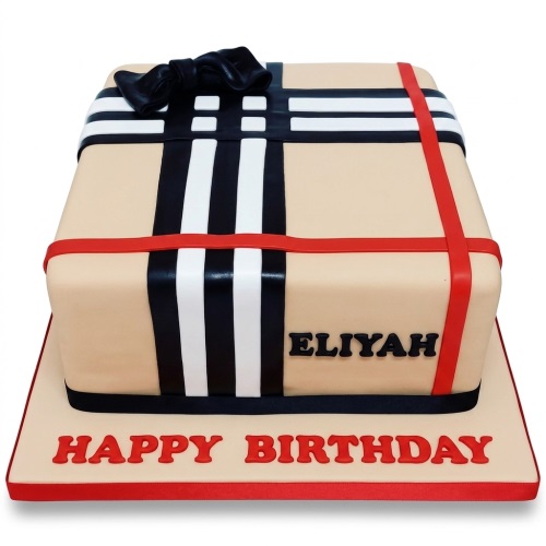 Beige square cake with black and white check pattern, red ribbons, black bow, and custom message.