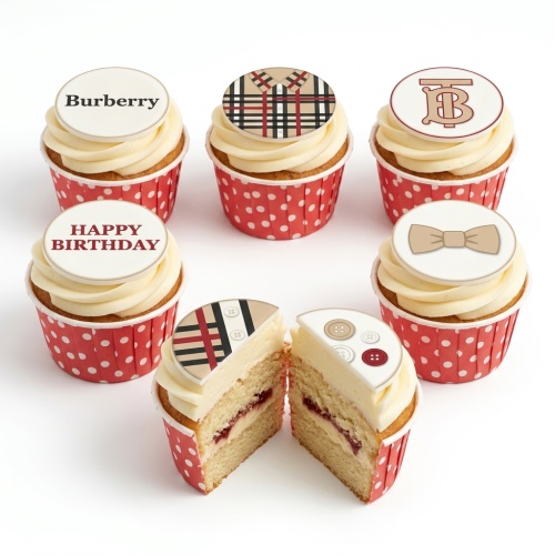 Cupcakes with cream frosting, red polka dot cases, and designer-inspired plaid, logo, bow tie, and "Happy Birthday" toppers.