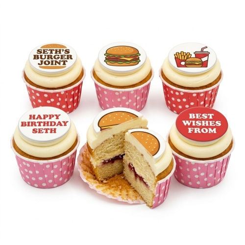 Six cupcakes with white frosting and fast food themed edible toppers, including a burger, fries, and custom messages, in red and pink polka dot wrappers.