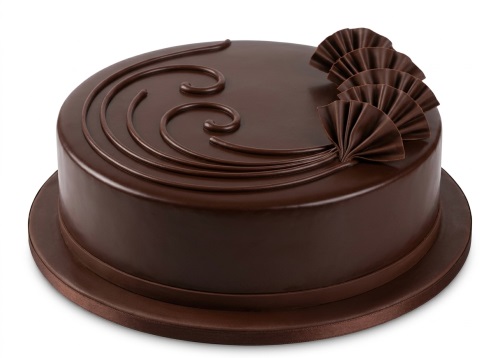 Round chocolate cake with smooth glaze, piped chocolate swirls, and chocolate fan decorations.