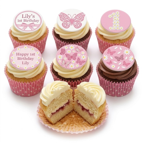 Set of pink and white cupcakes with butterfly and daisy toppers for a 1st birthday.