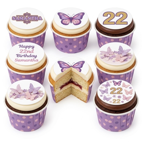 Butterfly themed cupcakes with custom age toppers and floral decorations in purple cases.