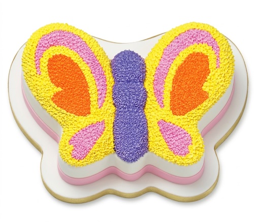 Colourful butterfly-shaped birthday cake with yellow, orange, pink, and purple frosting.