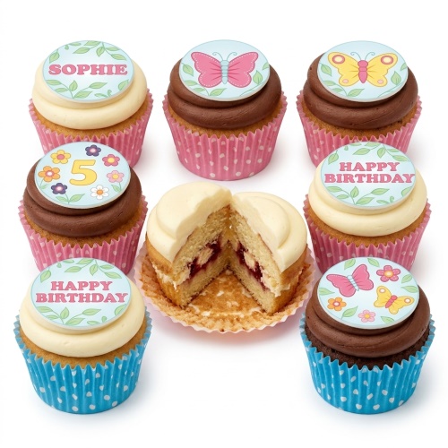 A selection of butterfly and floral themed birthday cupcakes with custom age and name toppers.