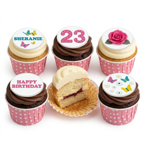 Set of birthday cupcakes with floral and butterfly toppers, custom age and name examples, in pink polka dot wrappers.