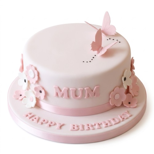 Round pink birthday cake with pink and white fondant flowers, pink butterflies, and a pink ribbon, with 'MUM HAPPY BIRTHDAY' text.
