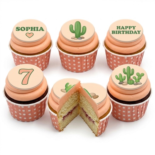 Six peach frosted cupcakes with edible cactus and custom message toppers, some with polka dot wrappers.