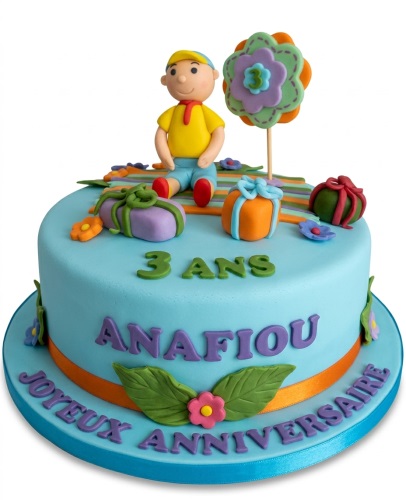 Light blue fondant birthday cake with a boy character, colourful gift boxes, and a custom age topper.