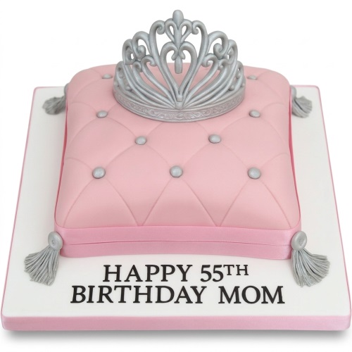 Pink quilted cushion birthday cake with a silver tiara and silver decorative buttons, ready for a custom message.