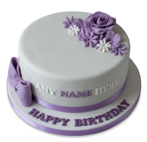 Elegant white round birthday cake with lavender and white fondant flowers, purple ribbon, and a personalised name option.