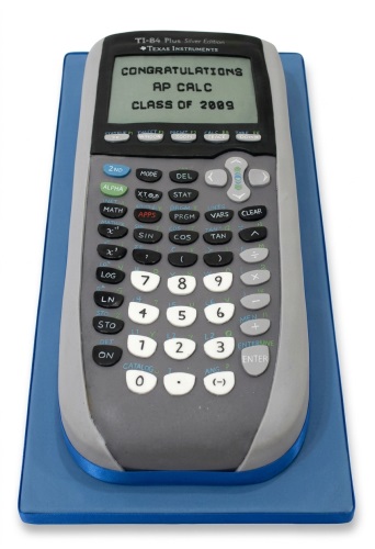 Grey calculator cake with black screen displaying a congratulatory message on a blue board.