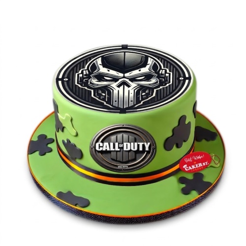 Round Call of Duty themed birthday cake with green and black camouflage, featuring game logos and a skull graphic.
