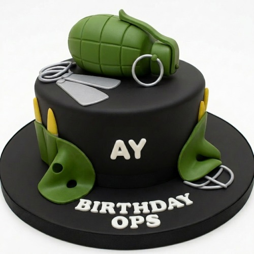 Black single-tier cake with green grenade topper, silver dog tags, and green military gear details.