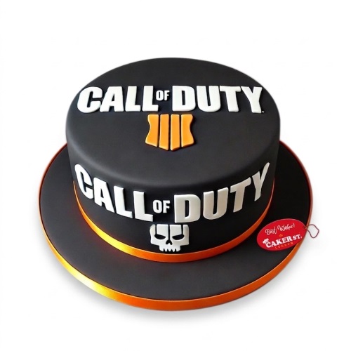Round black fondant cake with white 'CALL OF DUTY' text and orange emblem, featuring a white skull graphic.