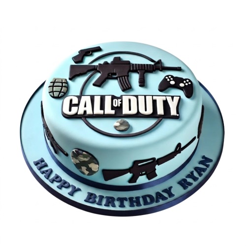 Round light blue Call of Duty birthday cake with black gun, grenade, and controller decorations.