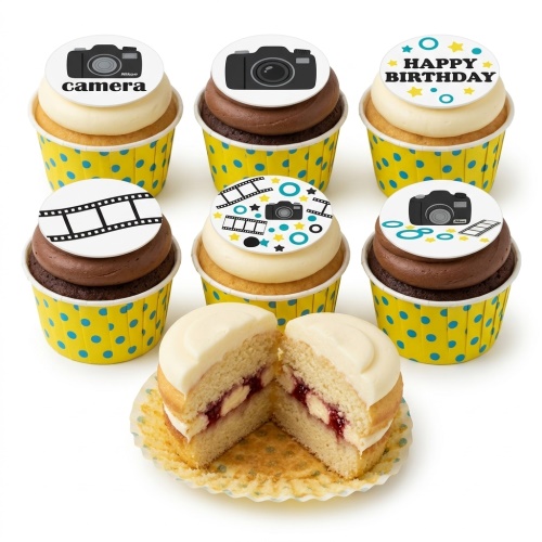 Assortment of vanilla and chocolate cupcakes with camera and film strip toppers in yellow polka dot wrappers.