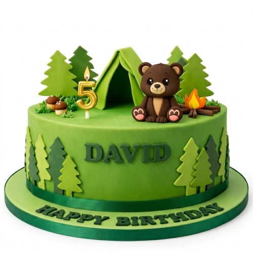 Green camping birthday cake with a brown bear, green tent, campfire, pine trees, and a custom age candle.