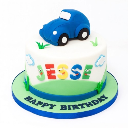 White fondant birthday cake with a blue car topper, green landscape, clouds, and personalised colourful letters.