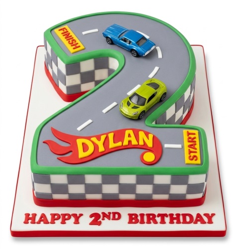 Number 2 shaped racing car birthday cake with blue and green cars on a track.
