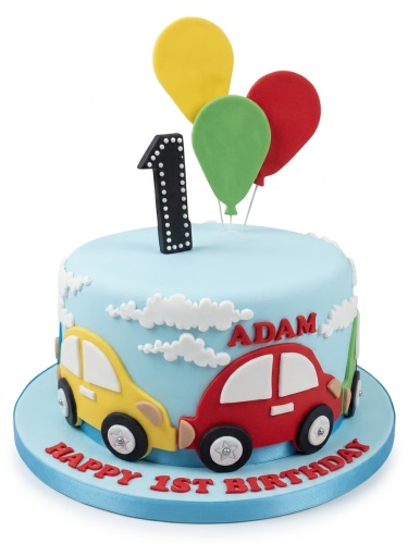 Light blue 1st birthday cake with red, yellow, green fondant cars, balloons, and clouds.