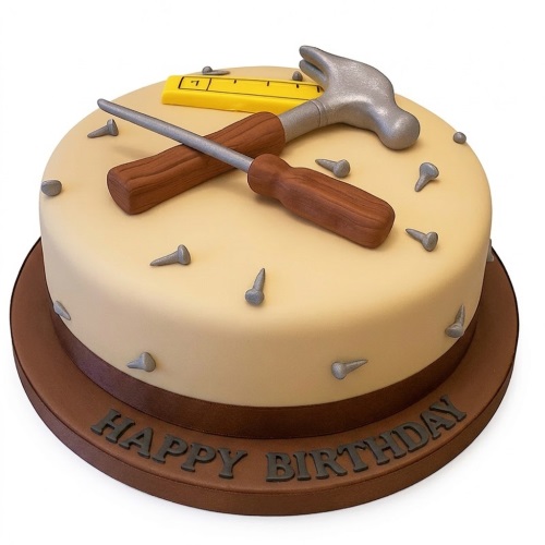 Round beige birthday cake decorated with edible hammer, screwdriver, ruler, and nails.