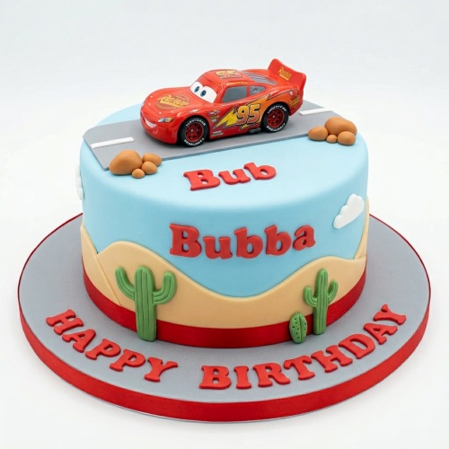 Round blue and tan cake with a red Lightning McQueen car, road, cacti, and clouds.