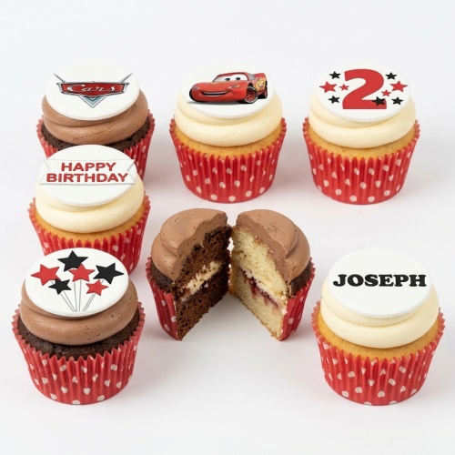 Assortment of Disney Cars themed cupcakes with Lightning McQueen, Cars logo, stars, "Happy Birthday" and custom name toppers.