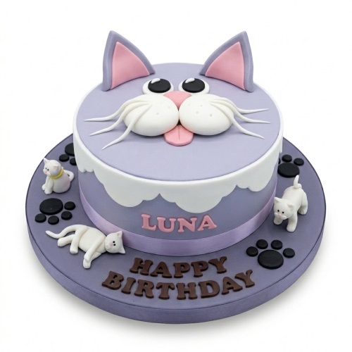 Round lavender cat face birthday cake with white kittens and paw prints, personalised with a name.