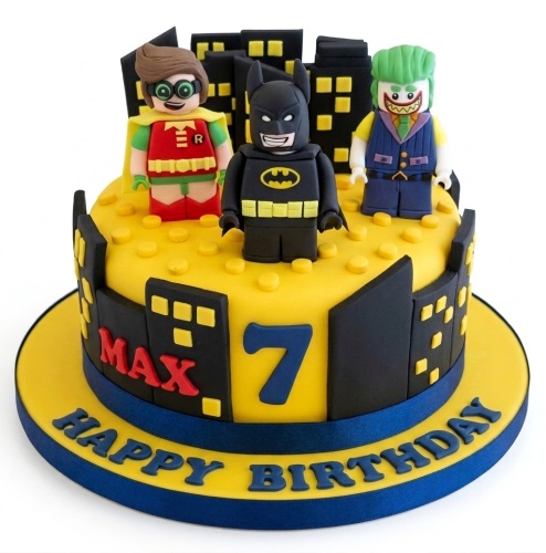 Yellow Batman Lego birthday cake with Robin, Joker, city skyline, and custom age.