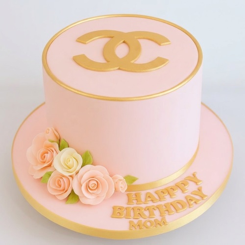 Pink and gold round birthday cake with Chanel logo and sugar flowers.