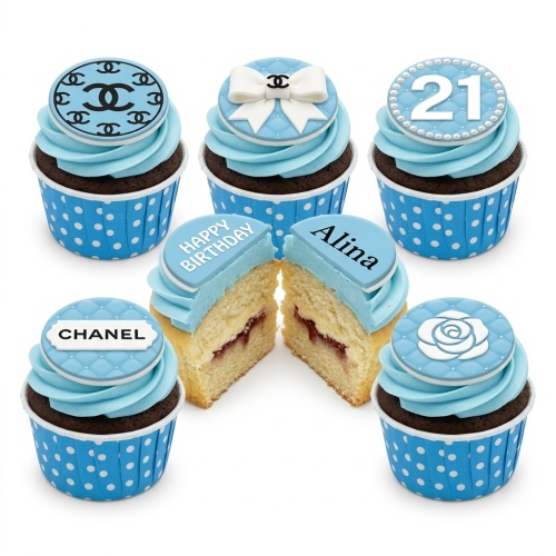 Chanel-inspired birthday cupcakes with light blue frosting, designer logos, bow, rose, and custom age topper.