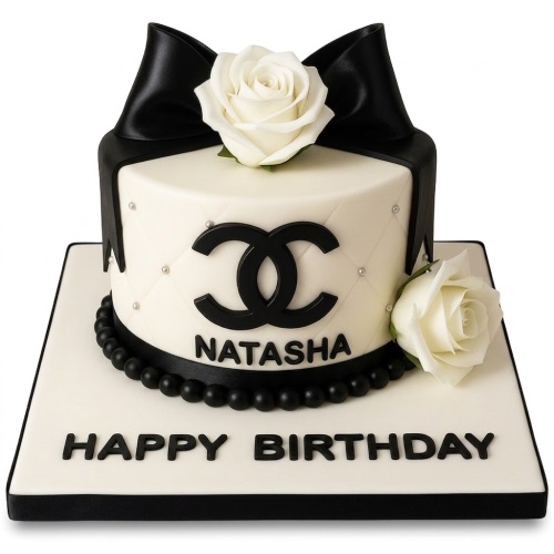 Black and white Chanel style birthday cake with a black bow, white roses, and custom name.