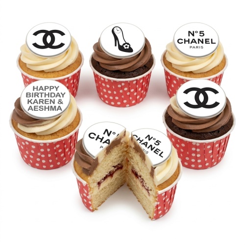 Six Chanel inspired cupcakes with double C logo, N°5 Chanel Paris, and high heel shoe toppers, in red polka dot wrappers.
