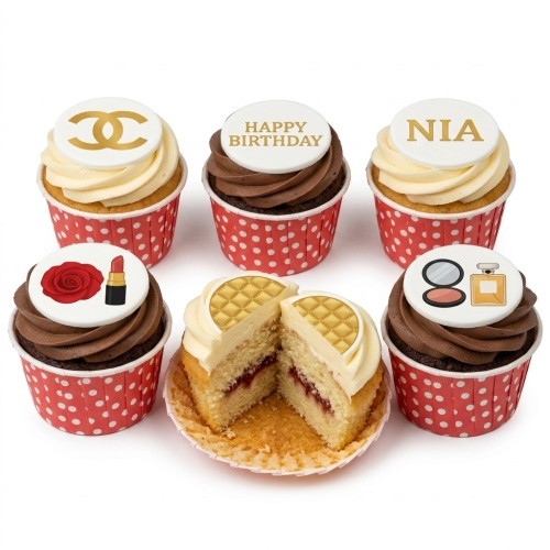 Luxury fashion themed cupcakes with designer logo, lipstick, rose, compact mirror, and perfume bottle decorations.