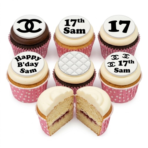Chanel style birthday cupcakes with white frosting, black and white toppers, and pink polka dot wrappers.