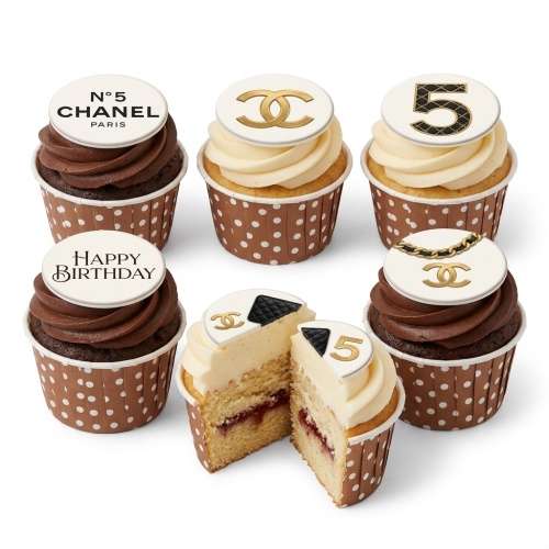Six cupcakes with white and gold Chanel-inspired toppers, including N°5, double C logo, and quilted patterns, in polka dot cases.
