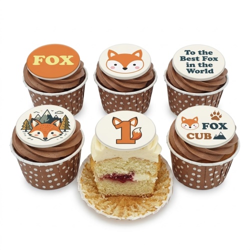 Six fox themed birthday cupcakes with chocolate and vanilla frosting, polka dot cases, and custom age toppers.