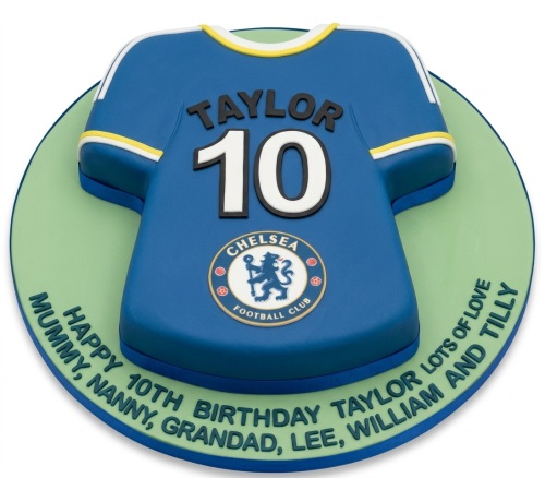 Blue Chelsea football shirt birthday cake with club badge, custom name, and number on a green board.