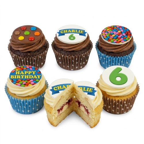 Assortment of kids birthday cupcakes with custom age toppers, personalised name banner, and candy sprinkles.