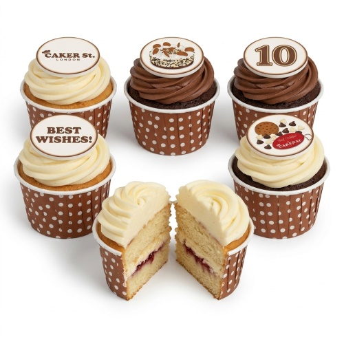 Selection of vanilla and chocolate cupcakes with white and brown frosting, featuring custom age and 'Best Wishes!' toppers, and Caker Street branding.