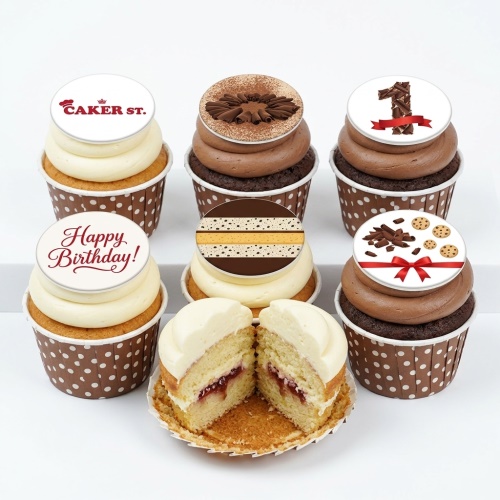 Selection of chocolate and vanilla birthday cupcakes with chocolate curls, stripes, 'Happy Birthday!' and '1' edible toppers.