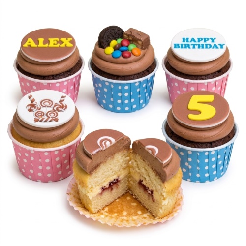Assortment of kids birthday cupcakes with chocolate frosting, candy, custom name, age, and 'Happy Birthday' toppers.