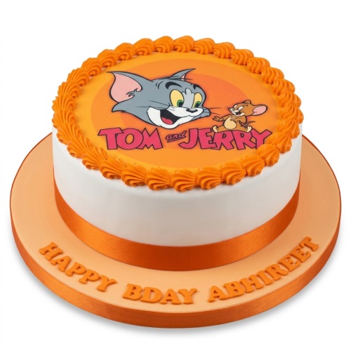 Round white cake with orange trim, featuring an edible Tom and Jerry image and a personalised message on the board.