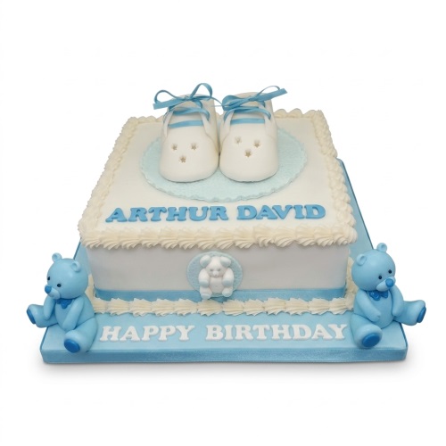 White and blue baby shower cake with baby booties and teddy bears.