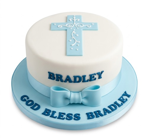 White and blue Christening cake for a baby boy with a cross design, ribbon, bow, and customisable name.