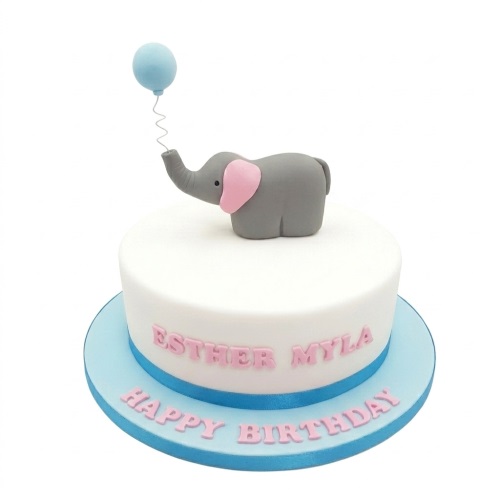 White round cake with a grey elephant fondant topper holding a blue balloon, with pink personalised message.